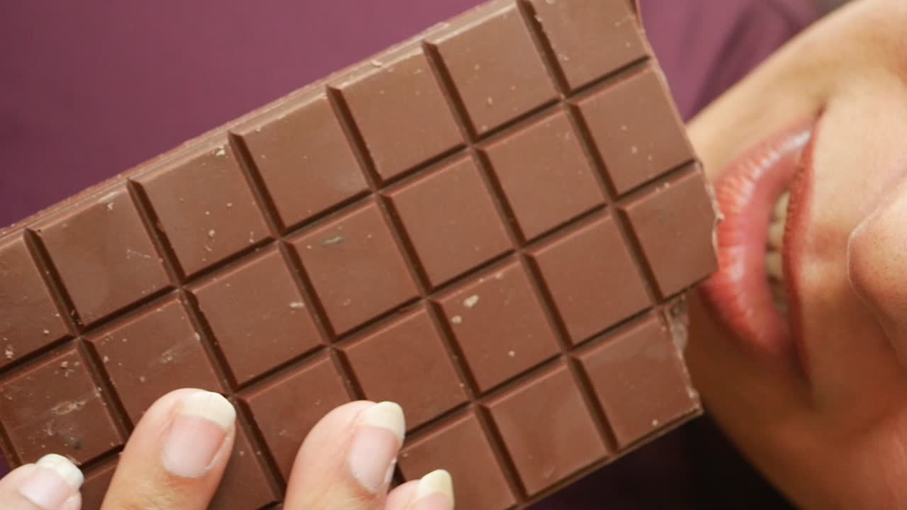 Eating a chocolate bar