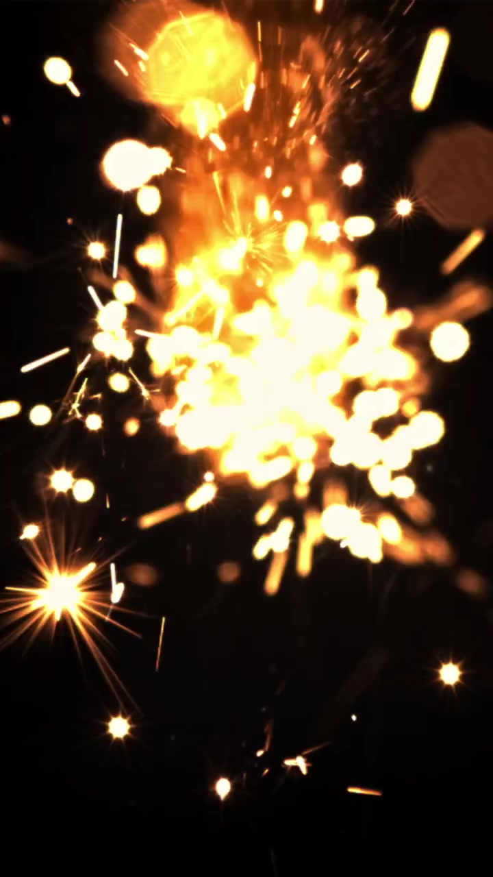 Scintillii dorati dinamici ed effetto luce bokeh su sfondo nero