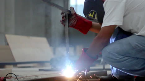 focused welder fuses steel beams, surrounded by flying sparks and smoke in a precise moment of industrial artistry.