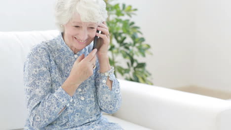 old woman calling with mobile phone