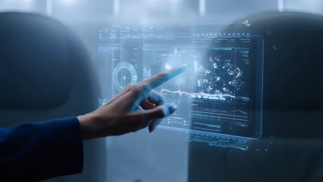 hand interacting with futuristic holographic data display