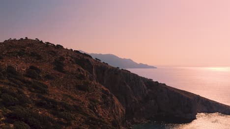 beautiful drone view of turquoise ocean water at mediterranean sea with sail boat during sunset