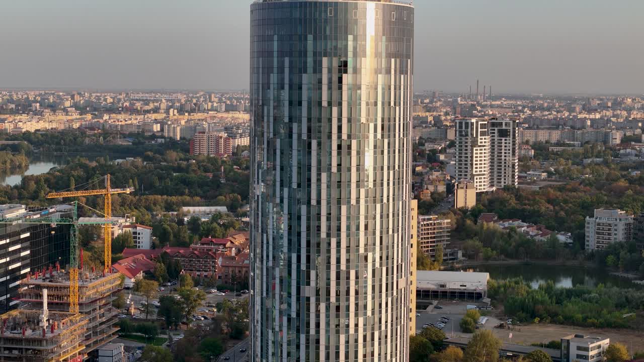 Slow Cinematic Reveal Of Bucharest Business District at Sunset - A Bird's-Eye View