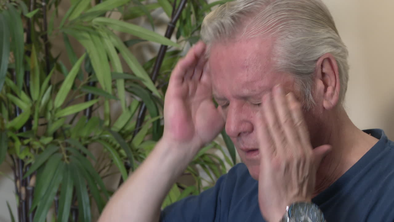 Man experiencing pain and discomfort