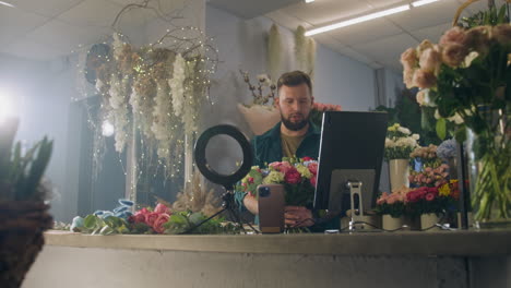florist arranging a bouquet in a flower shop