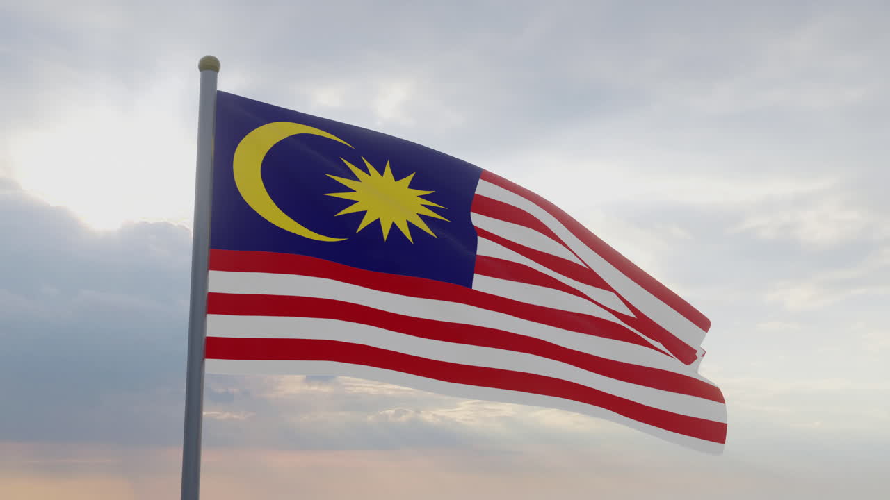 La bandera de Malasia ondeando en el viento