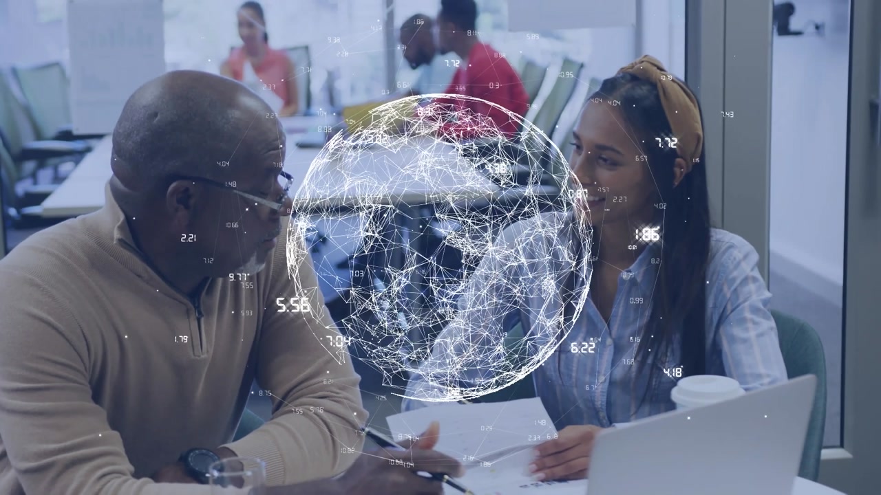 Animation of globe of network of connections over diverse man and woman discussing at office