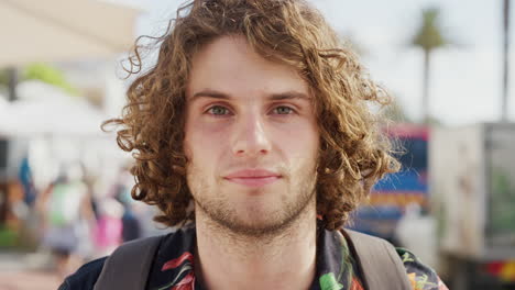 young man portrait on a city street