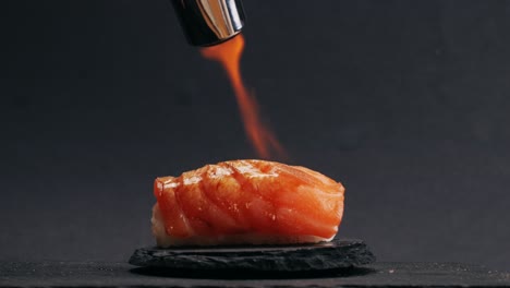 flaming salmon nigiri sushi