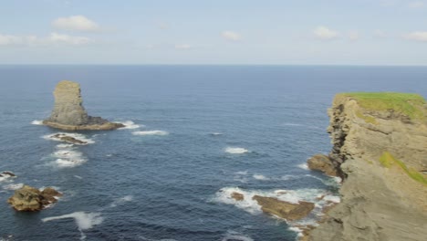 panoramic view of the atlantic ocean along the rugged kilkee cliffs on a sunny day