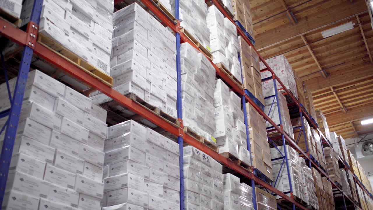 Warehouse shelves stacked high with boxes of inventory