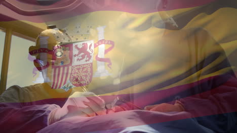 animation of flag of spain waving over surgeons in operating theatre