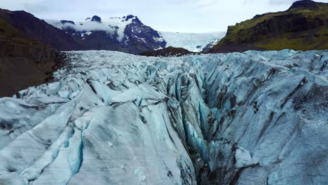 aerial view of svinafellsjokull glacier with deep crevasses in iceland