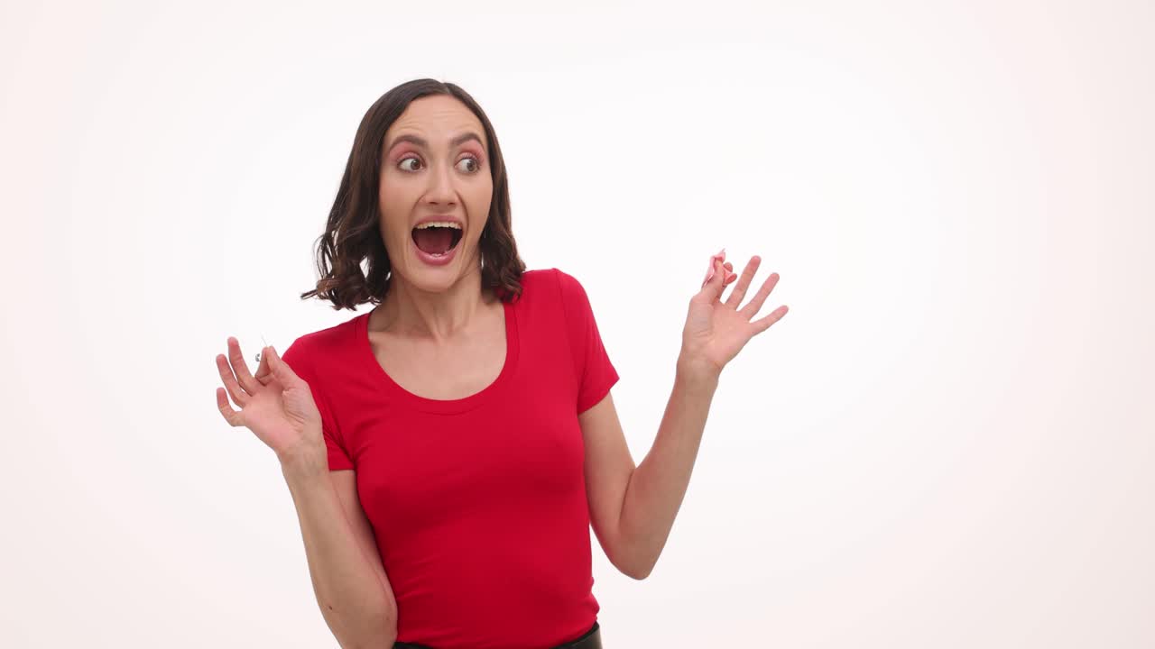 Woman's varying reactions while interacting with a pink balloon
