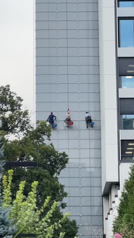 window cleaners on a high-rise building