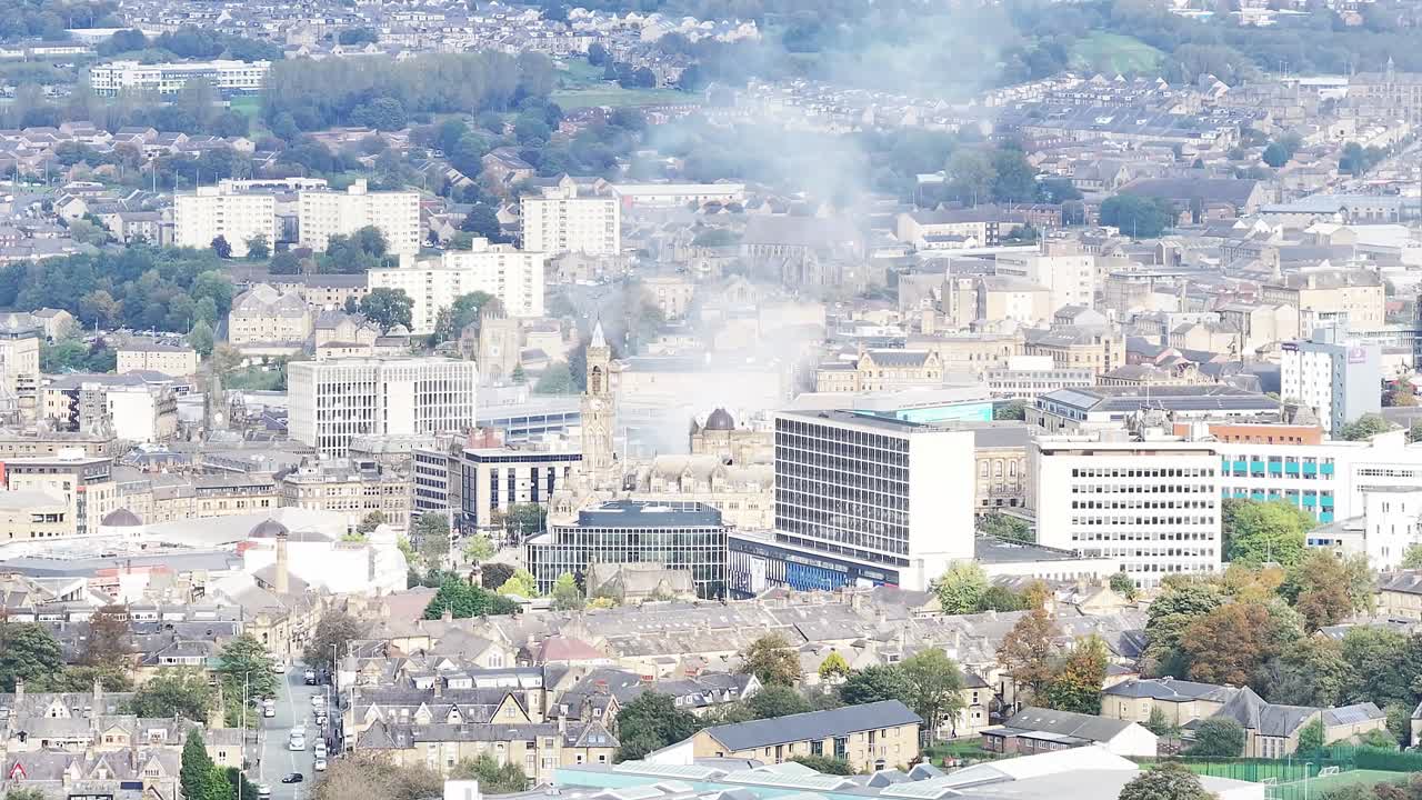 Aerial View of City with Smoke Plume