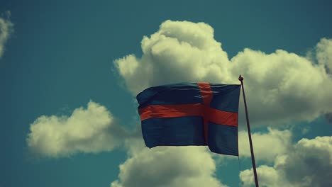 The-Swedish-flag-is-waving-intensely-on-a-windy-summer-day