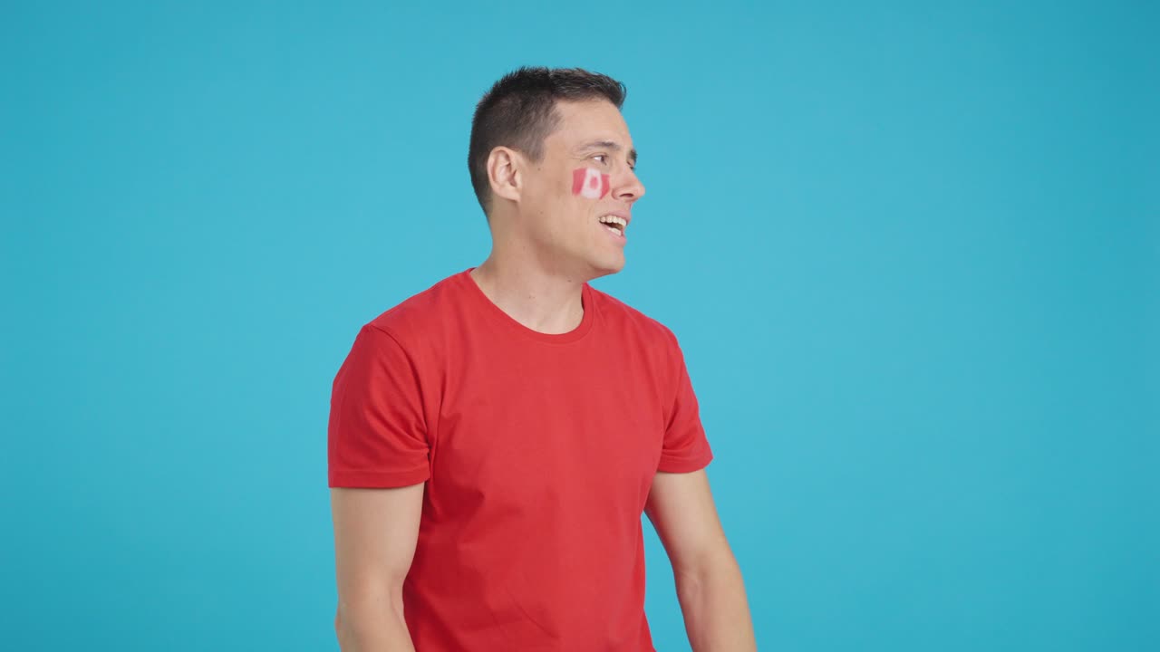 Man cheering for Canada during a match that is lost