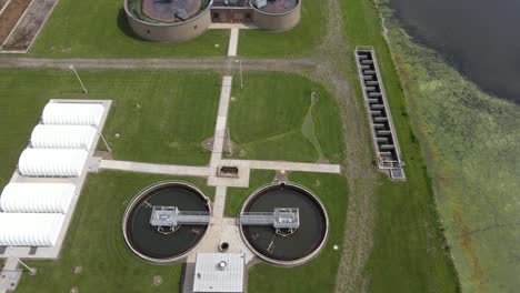 Circles-of-water-treatment-buildings-in-East-China,-Michigan,-aerial-view