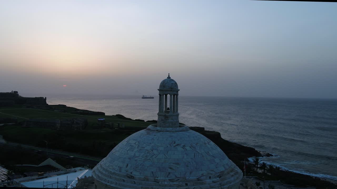 Hazy Sunset in Old San Juan Puerto Rico and Merchant Ship heading out to the Atlantic Ocean