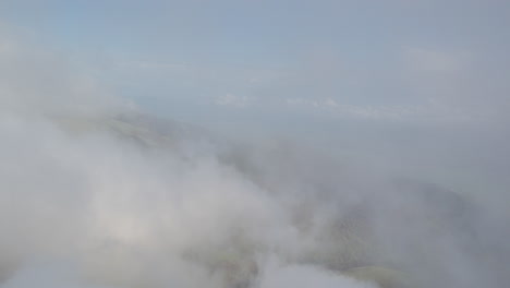 mountainous landscape with clouds and fog