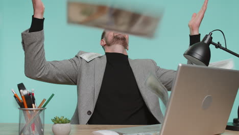 money cash dollar rain falling on business man celebrating success winning lottery jackpot luck