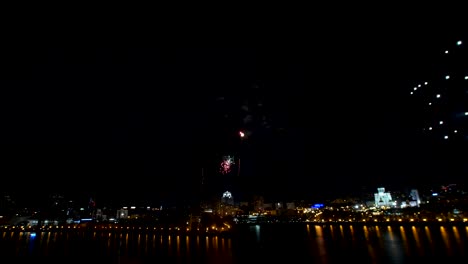 fireworks over the city at night