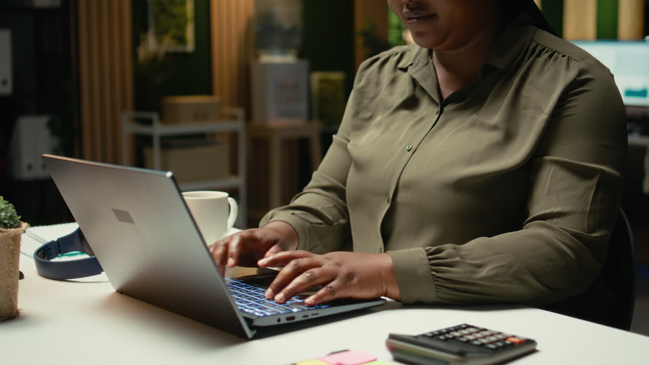 Female specialist working after hours on proofreading and fact checking