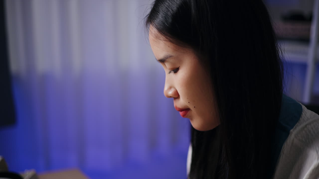 Young woman studying or working in a room