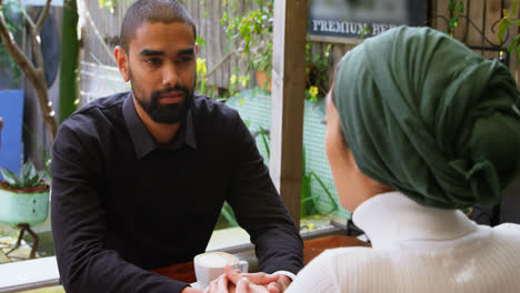 couple interacting with each other in cafeteria 4k