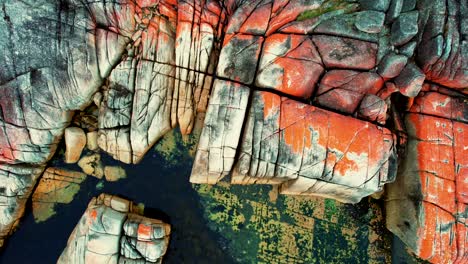 Bay-Of-Fires-Drone-Spiral-of-Orange-Boulders-Tasmania,-Australia