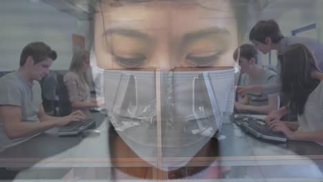 Woman-in-face-mask-against-office-colleagues-using-computer