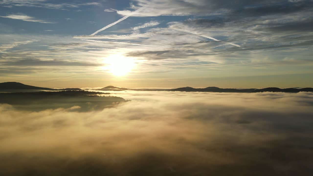 The video is from a drone passing through foggy clouds during sunrise. The sun is higher in this video that the previous video. Fog clouds were approximately 100 feet off the ground. 4k 30fps