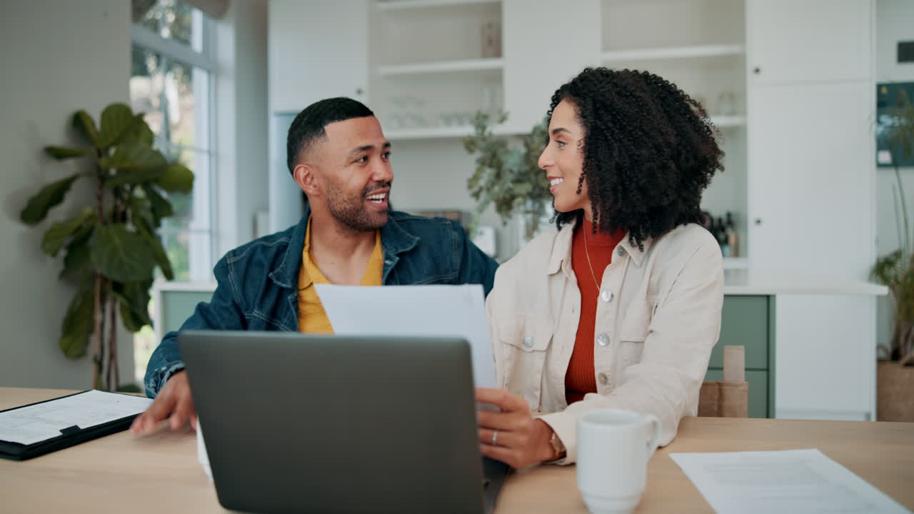 Couple reviewing finances at home