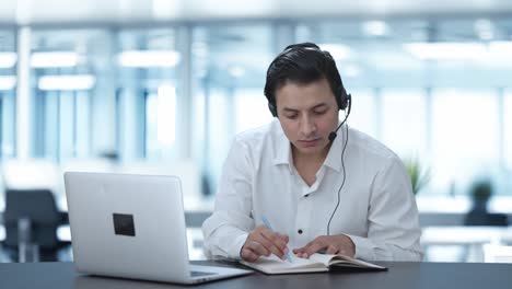 Indian-call-center-employee-explaining-something-to-customer