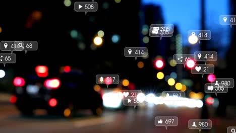 Animation-Von-Social-Media-Symbolen-Und-Zahlen-über-Unscharfen-Stadtlichtern