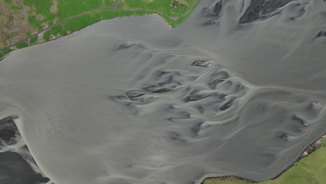 aerial top shot over a river in iceland freezing glacier water