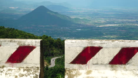 shot of winding road against beautiful mountain backdrop in vietnam