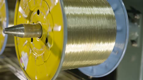 camera shows bobbins with textile threads close view