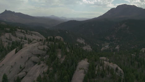 summer deckers colorado river fishing and tubing mountain hike in wilderness with boulders cinematic pan forward cloudy afternoon