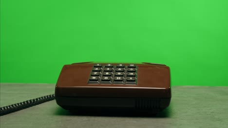 retro vintage phone, a yellow rotary telephone is displayed on a wooden desk, adding a nostalgic touch