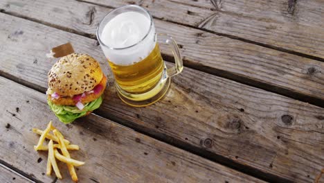 beer and snacks on wooden table