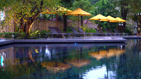 umbrella and pool bed decoration around swimming pool in hotel resort