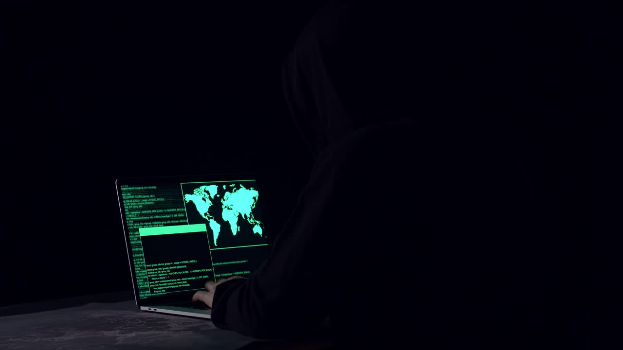 Hacker Using Laptop Computer Hacking In The Dark Room