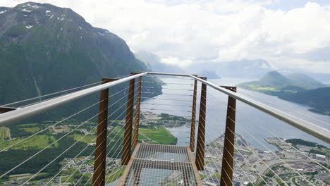 walking at the observation platform with scenic view of romsdals fjord and rugged mountain