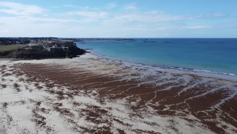 Small-castle-at-the-beach-of-penthievre-on-the-peninsula-of-quiberon-in-brittany-,-droneshot-in-nice-weather