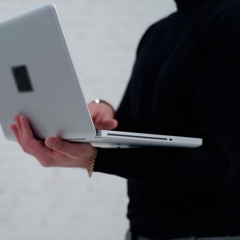 . young professional businessman. close up of male hands typing on notebook