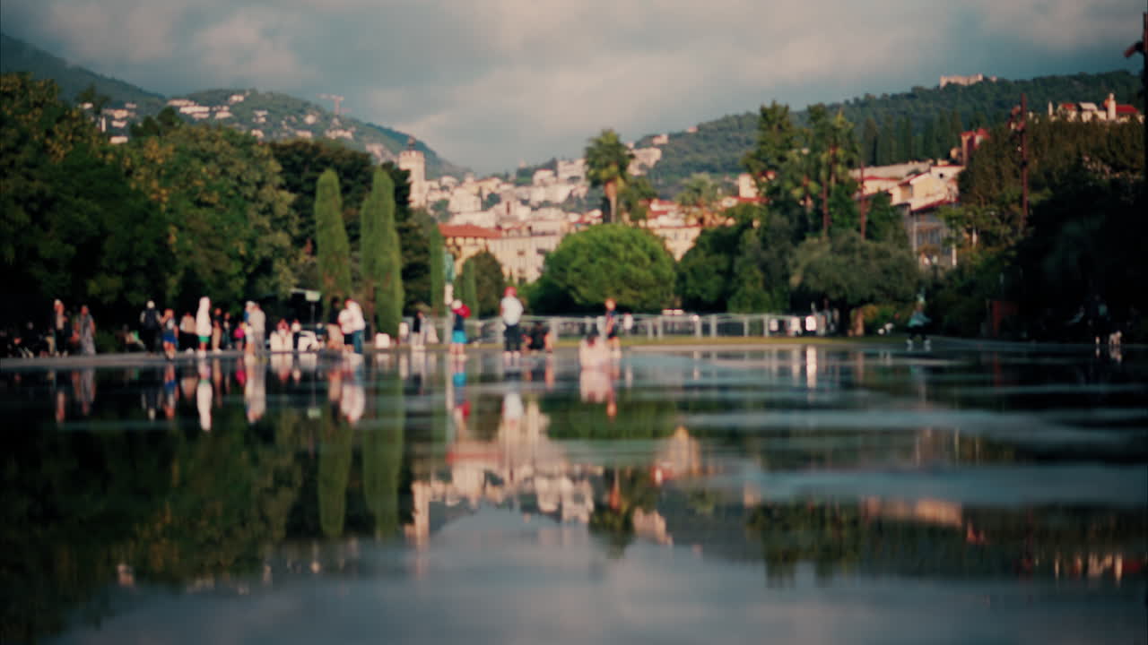Nice, France - October 11, 2024: People walking through the Promenade du Paillon park and garden