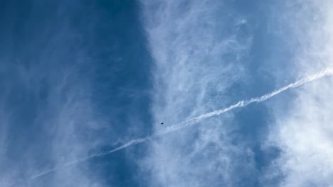 a jet leaves a vapor trail across a bright blue sky during an airshow in geelong, australia. dynamic and captivating aerial display
