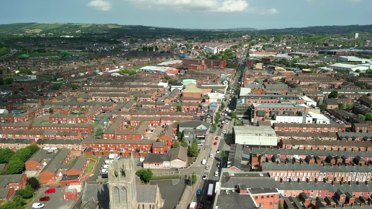 Rising and reversing aerial video of the Newtownards Road in East Belfast, Northern Ireland on a bright sunny day. Filmed in 4K, 60FPS and with Rec709 color.